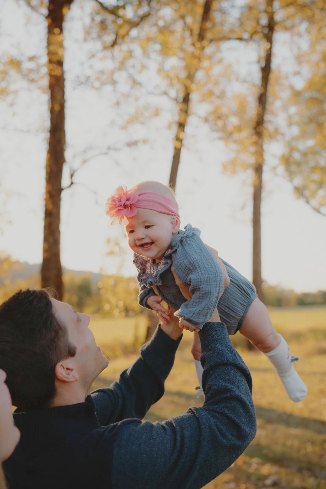 Father lifting his daughter in the air